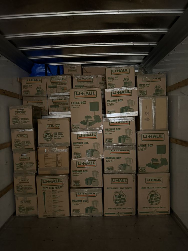 Wall of labeled boxes stacked tight inside the truck