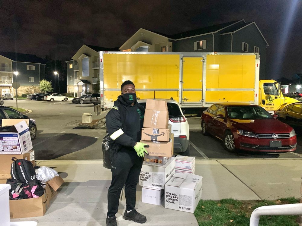Wayne's Enterprise mover loading boxes at night
